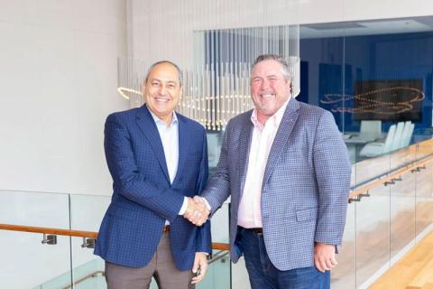 Hany Malik and Doug Wagoner shaking hands