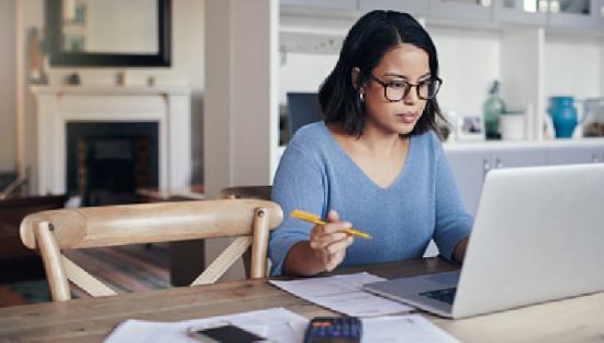 woman filling out form on laptop